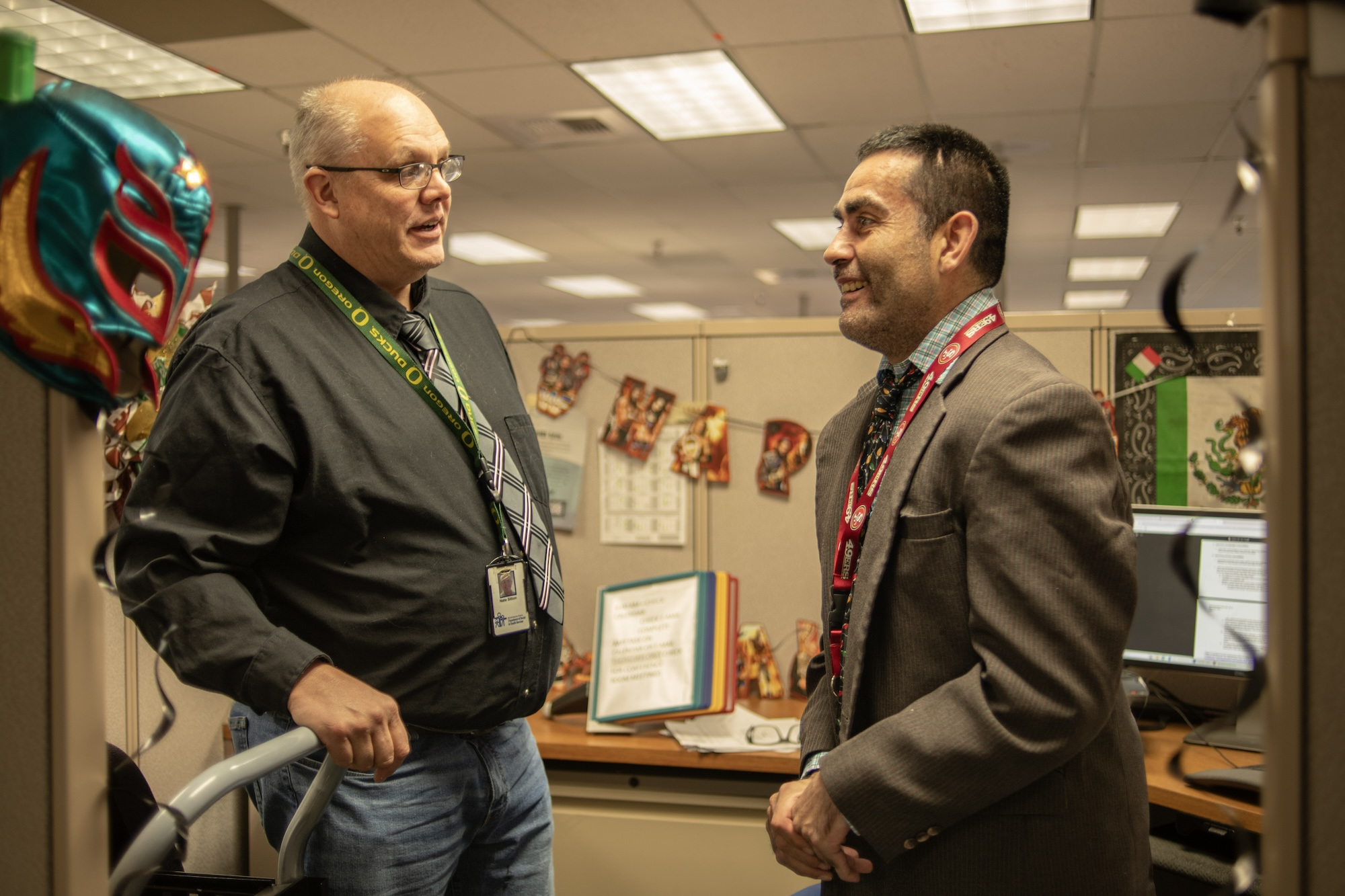 Nate and Eddie talking at the office